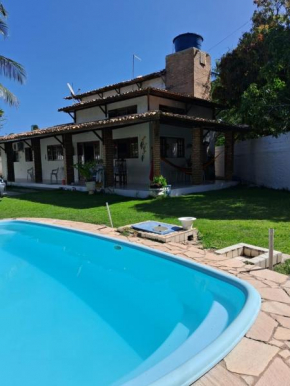 Casa de praia em condomínio exclusivo na Barra de Santo Antônio com piscina
